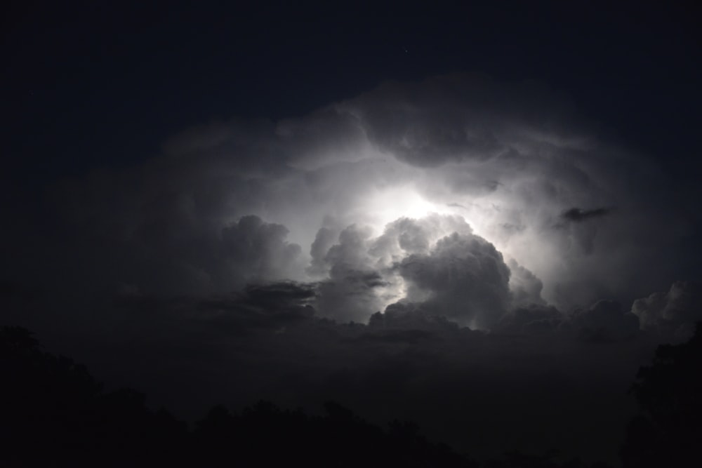 a dark sky filled with lots of clouds