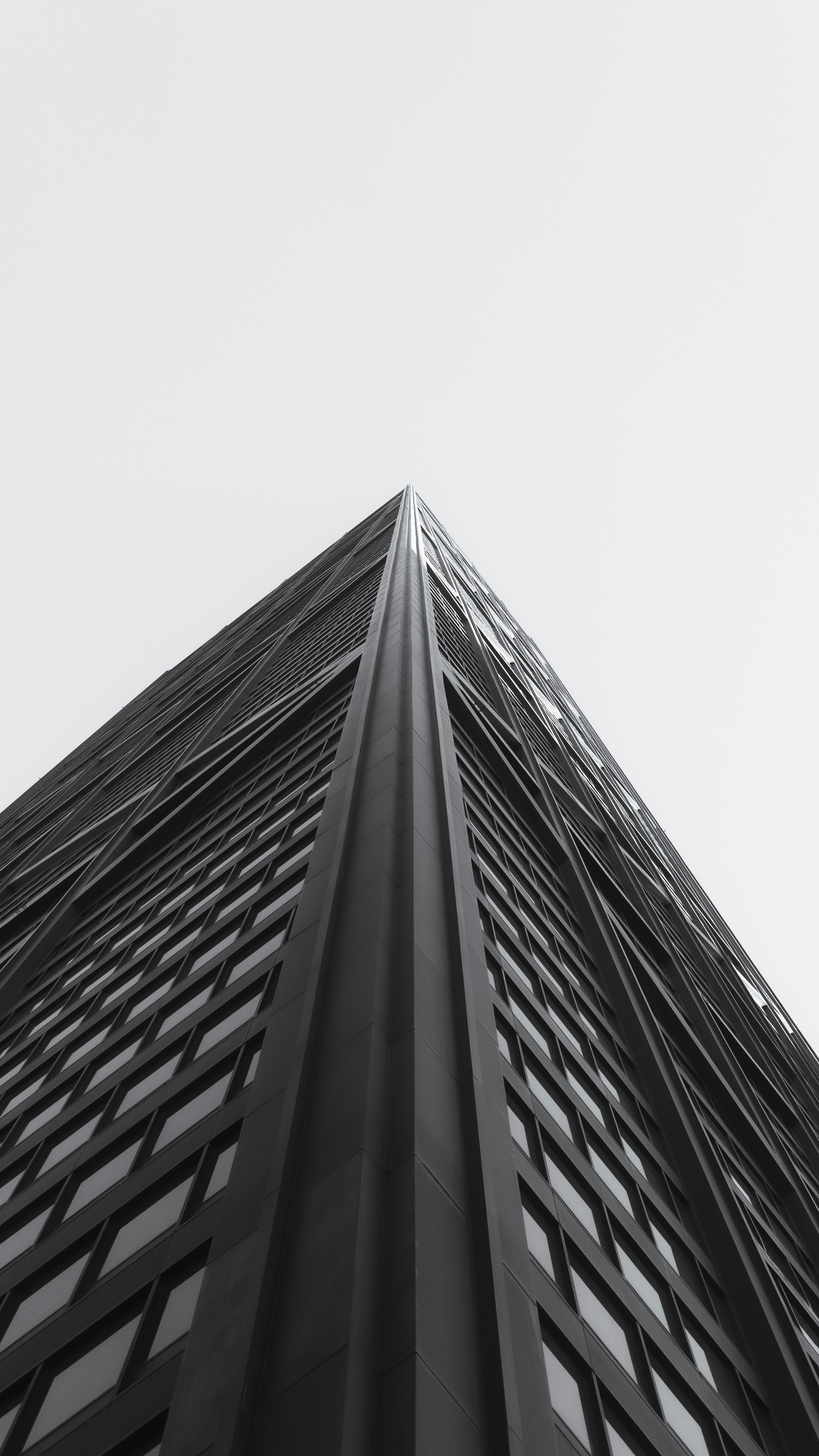 looking up at the top of a tall building