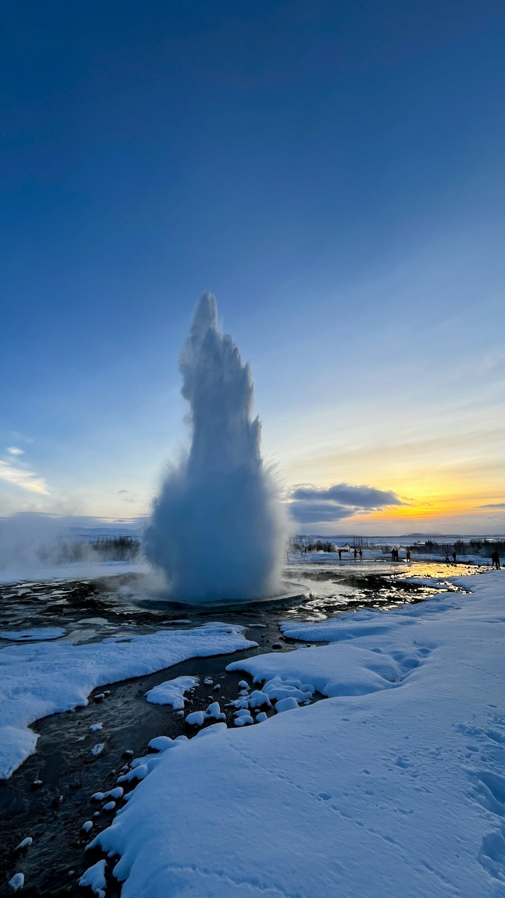 a large geyser spewing water into the sky