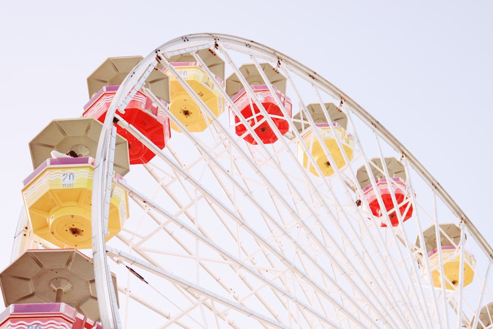 a large ferris wheel with colorful decorations on top of it