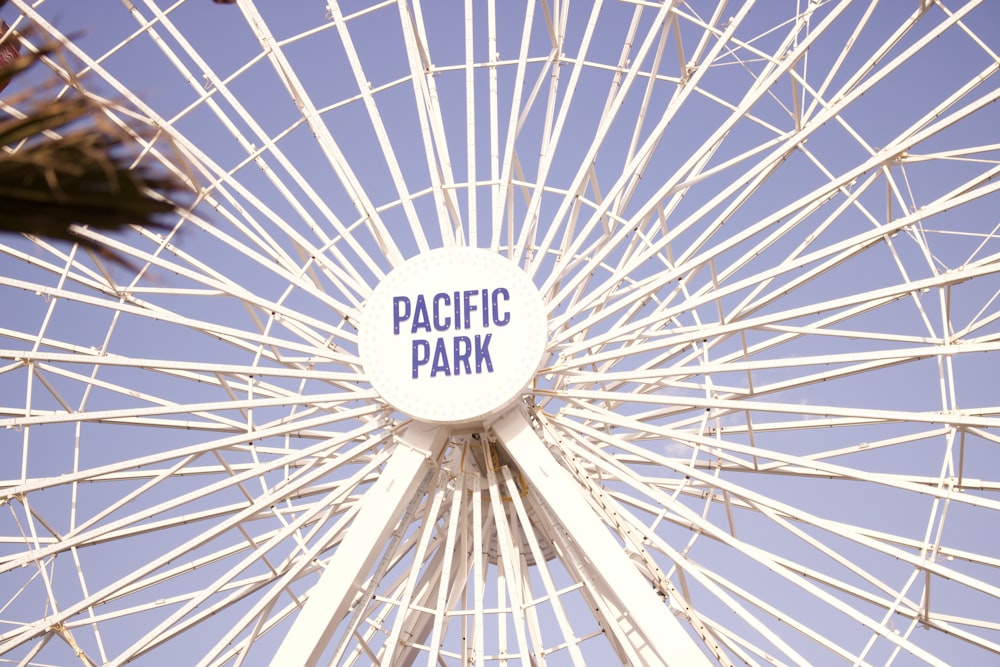 a large white ferris wheel with the words pacific park on it