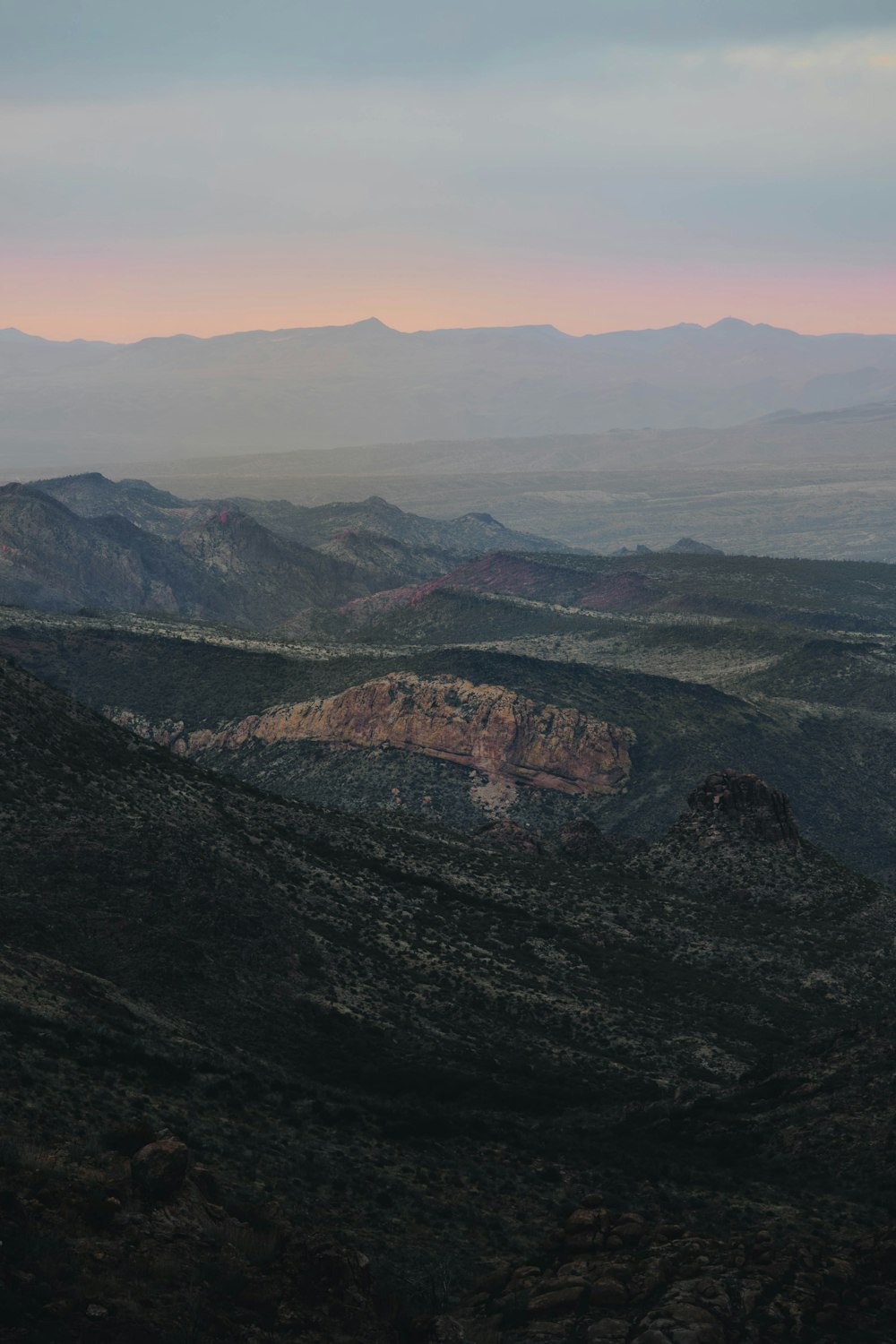 a view of a mountain range at sunset