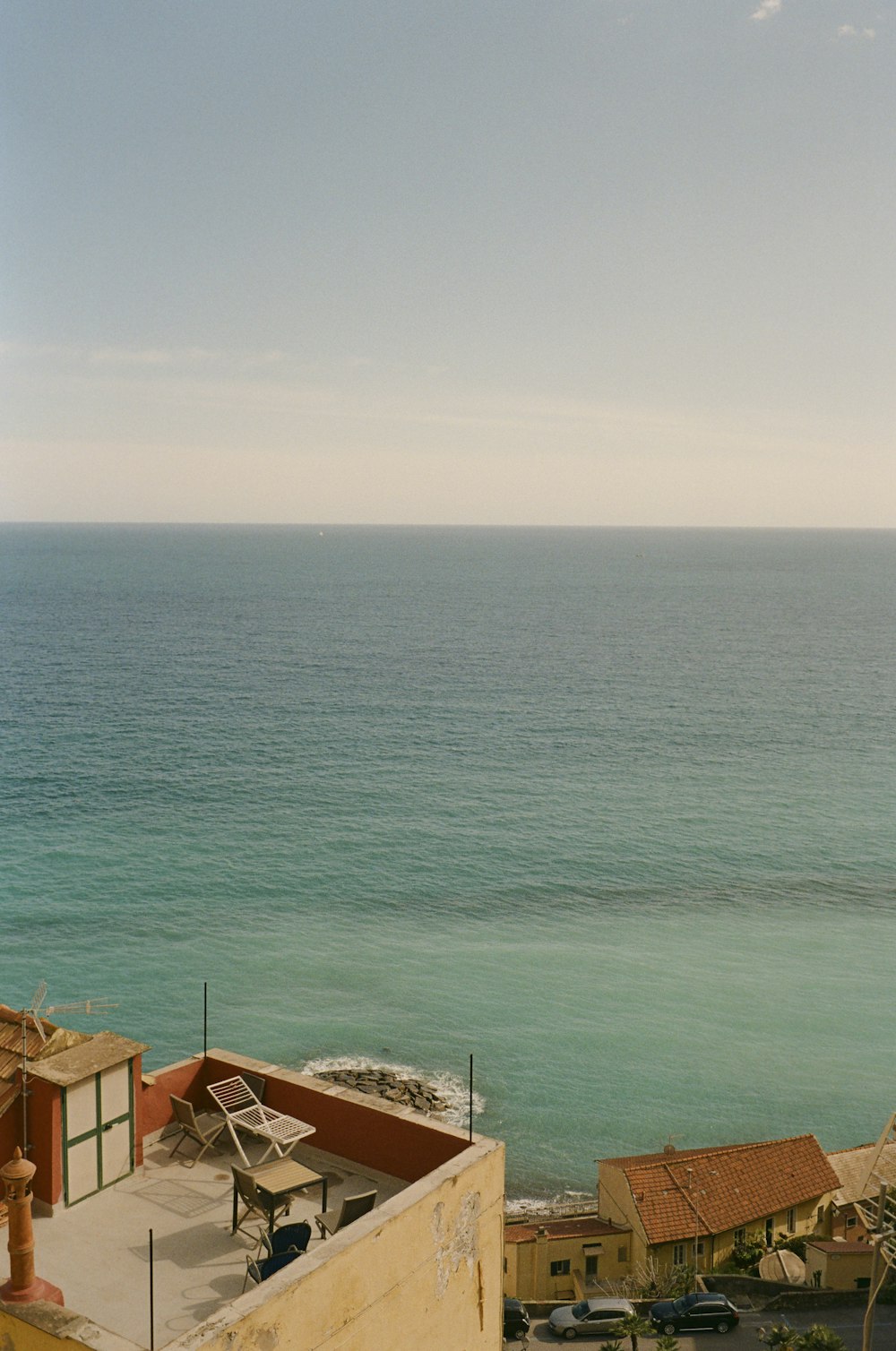 a view of the ocean from a rooftop of a building