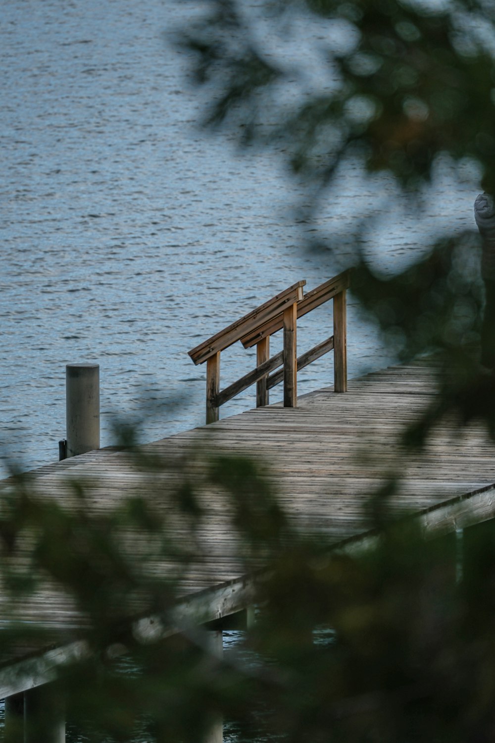 a bench sitting on top of a wooden pier