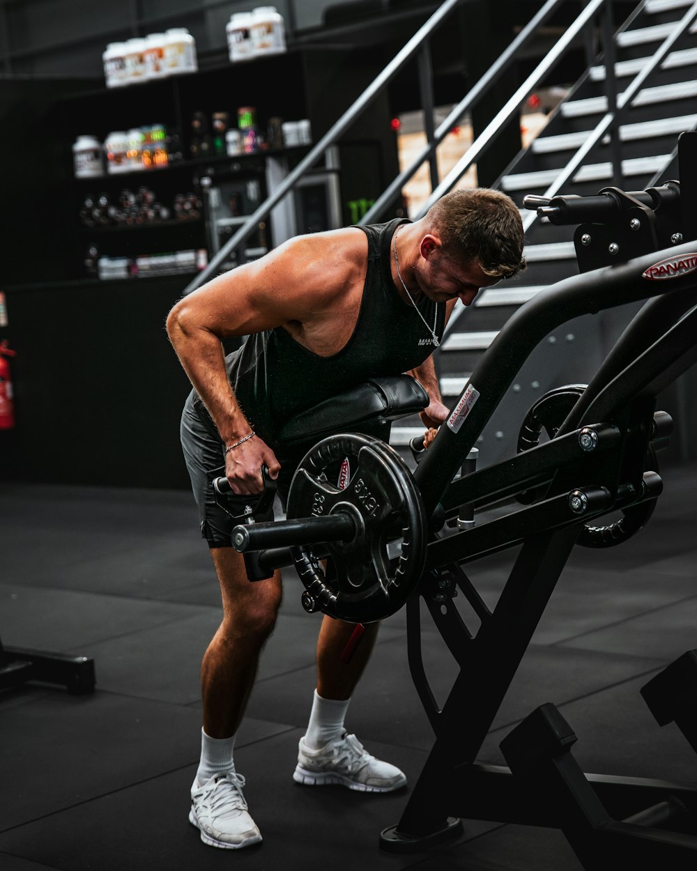 a man working out on a machine in a gym