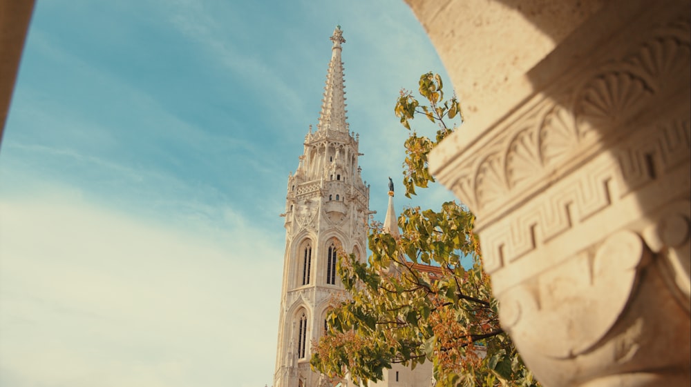 a tall tower with a clock on it's side