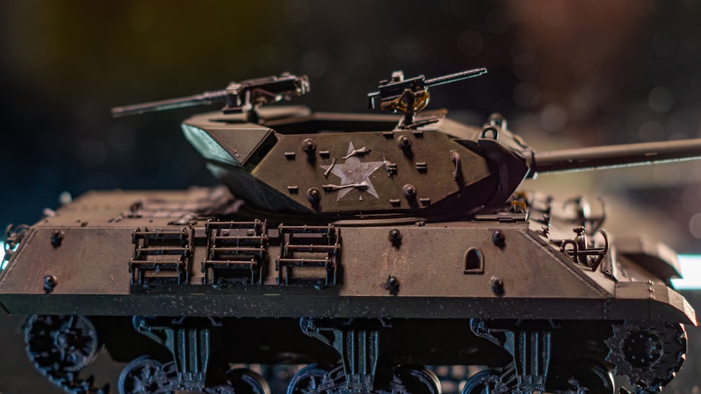 a close up of a toy tank on a table