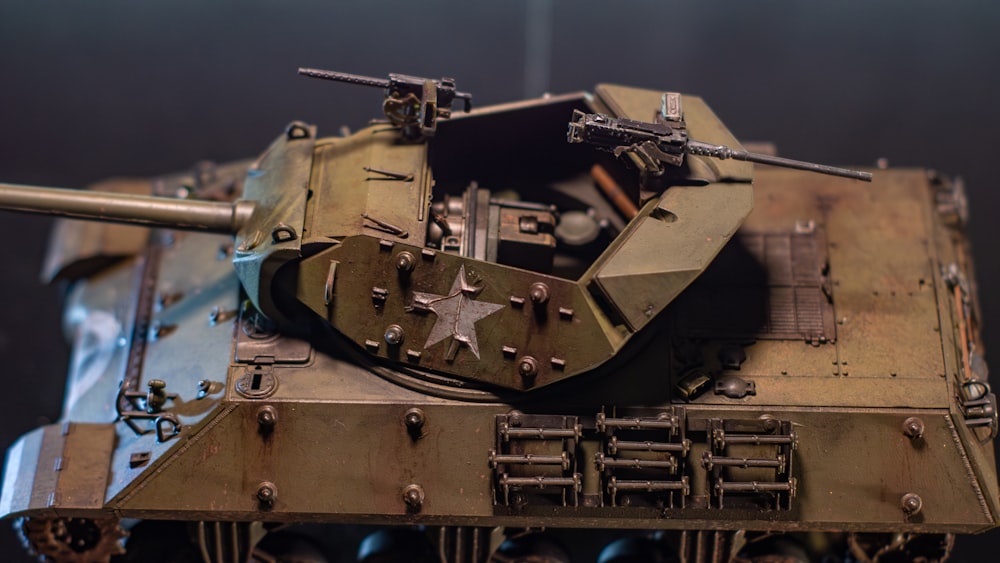 a close up of a toy tank on a table