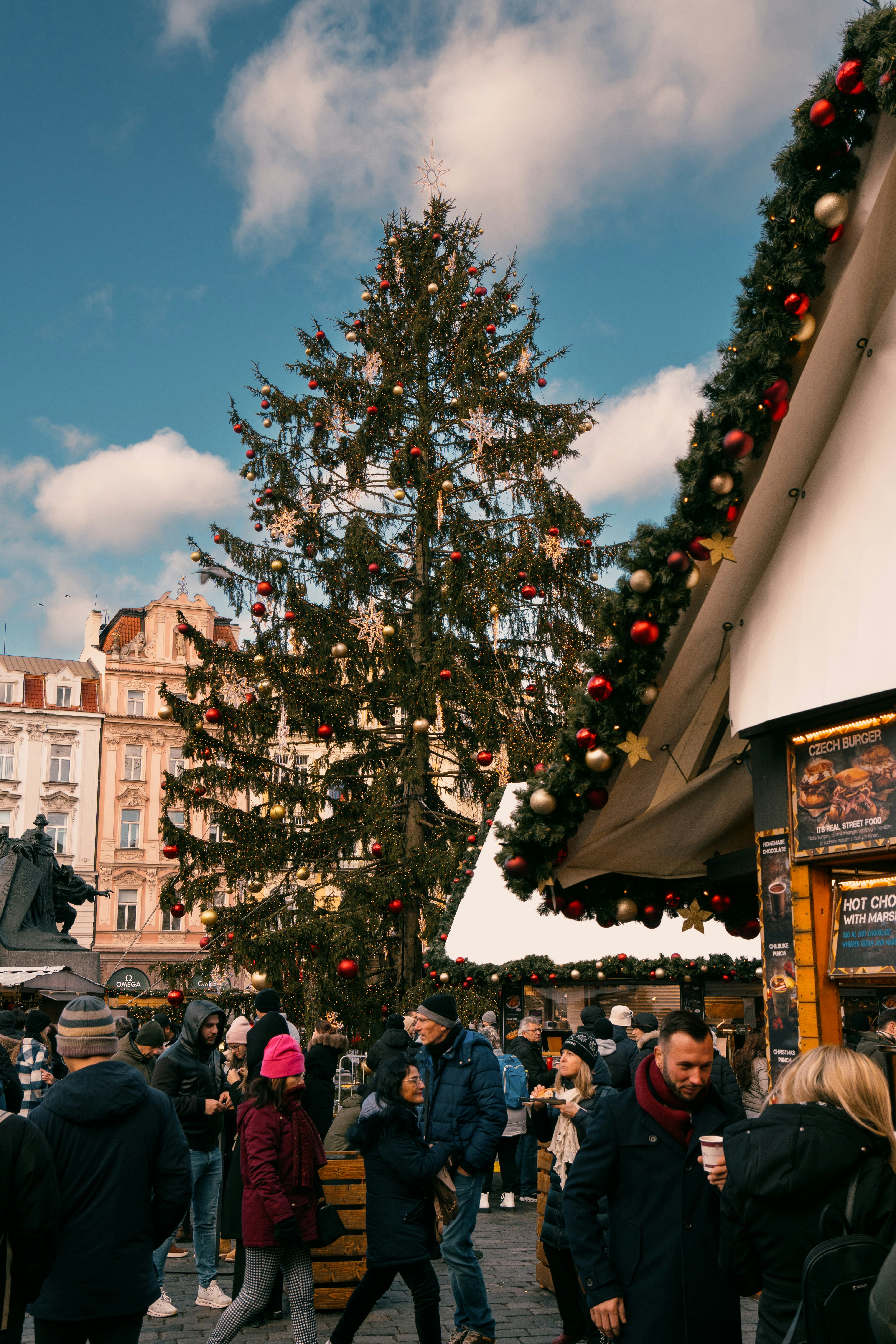 People standing around a Christmas tree