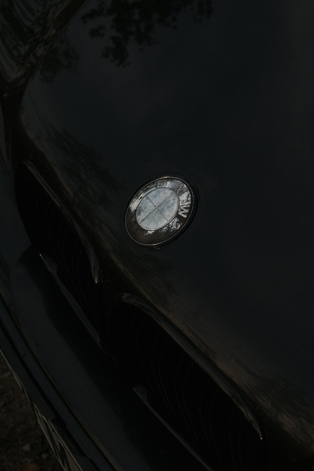 a close up of the front of a black sports car