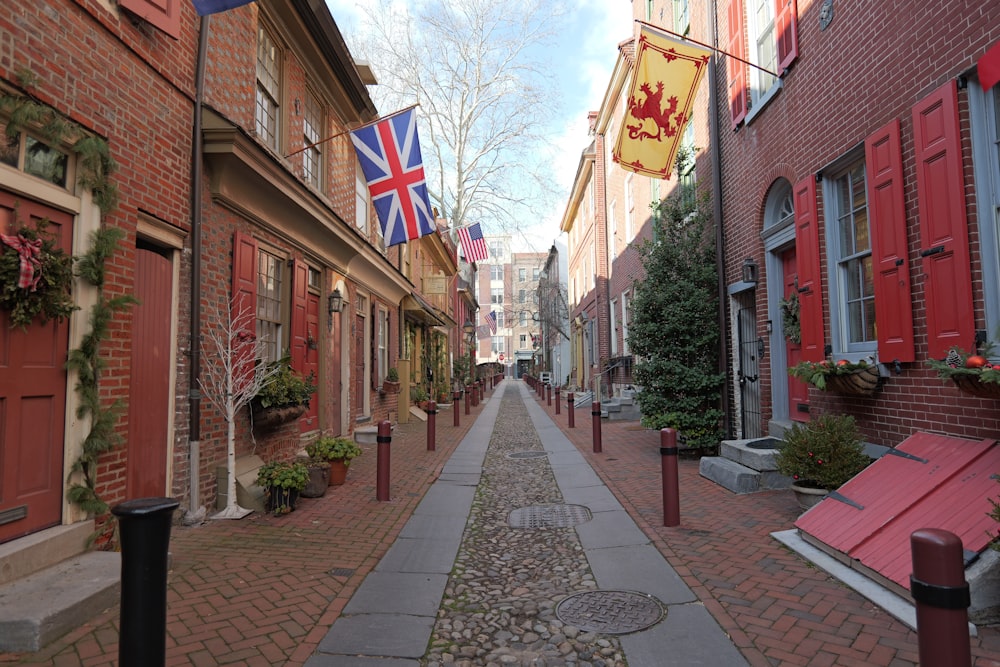 a narrow street lined with red brick buildings