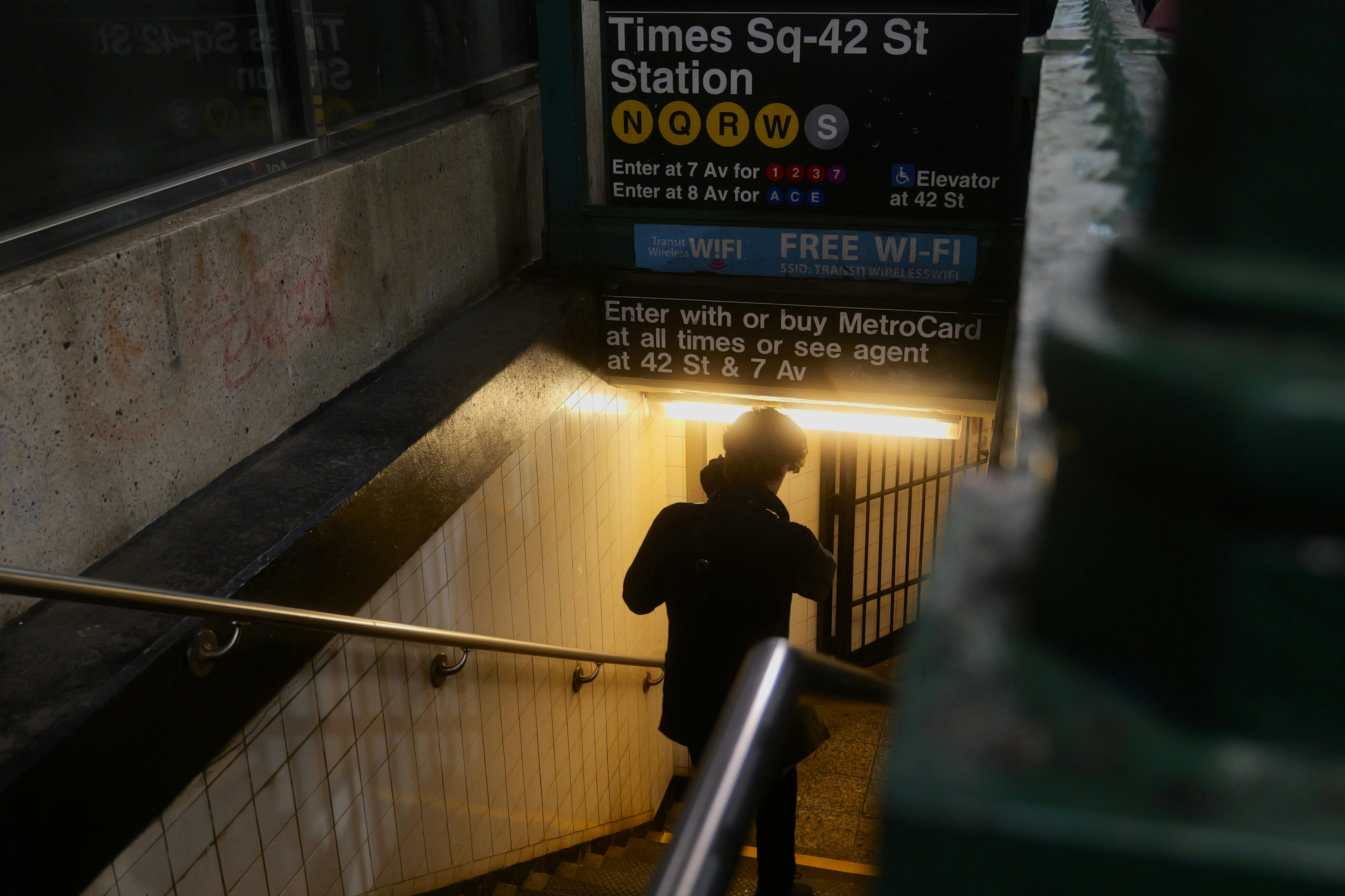 a person walking up a set of stairs
