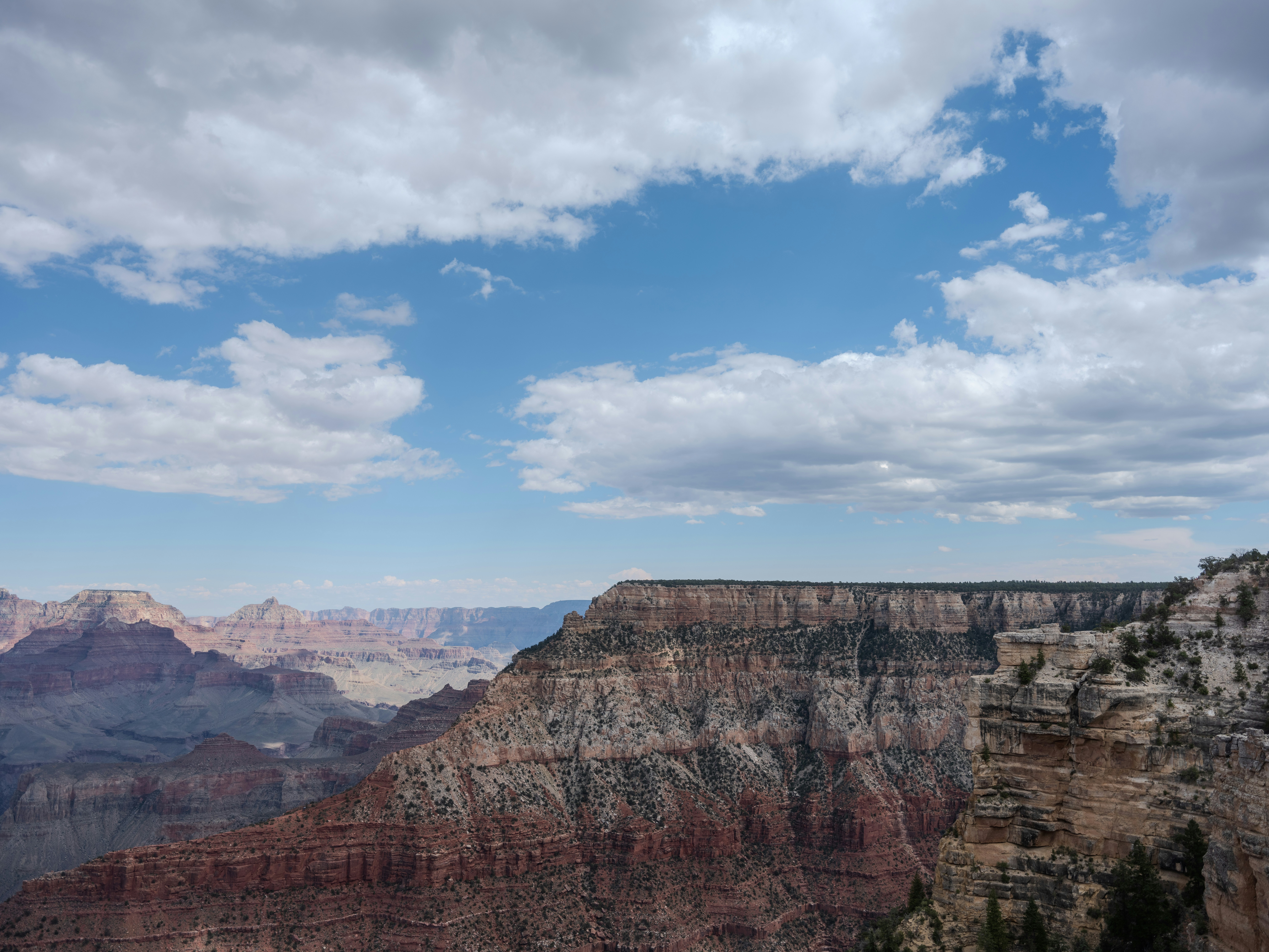 a view of the grand canyon from the edge of a cliff