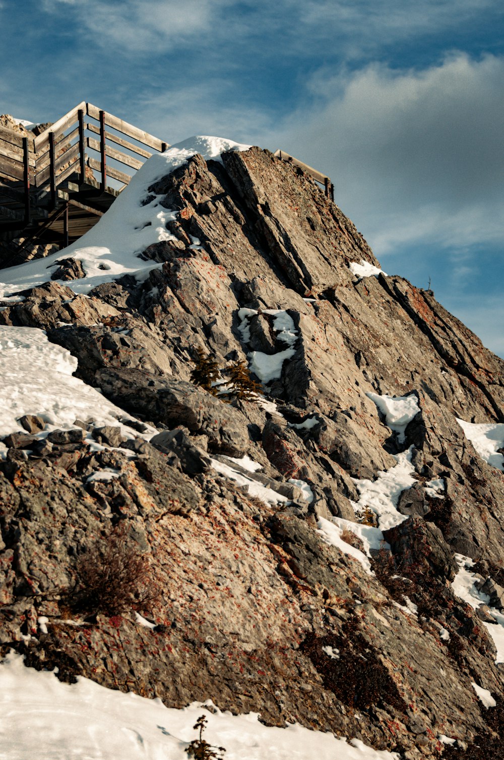 a person walking up a snowy mountain side