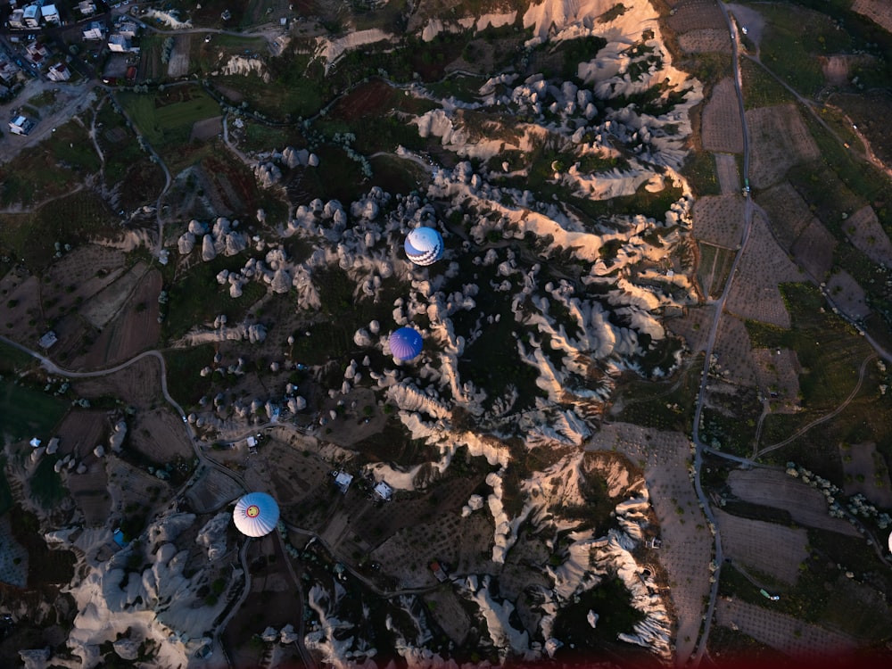 an aerial view of a mountain with several satellite dishes