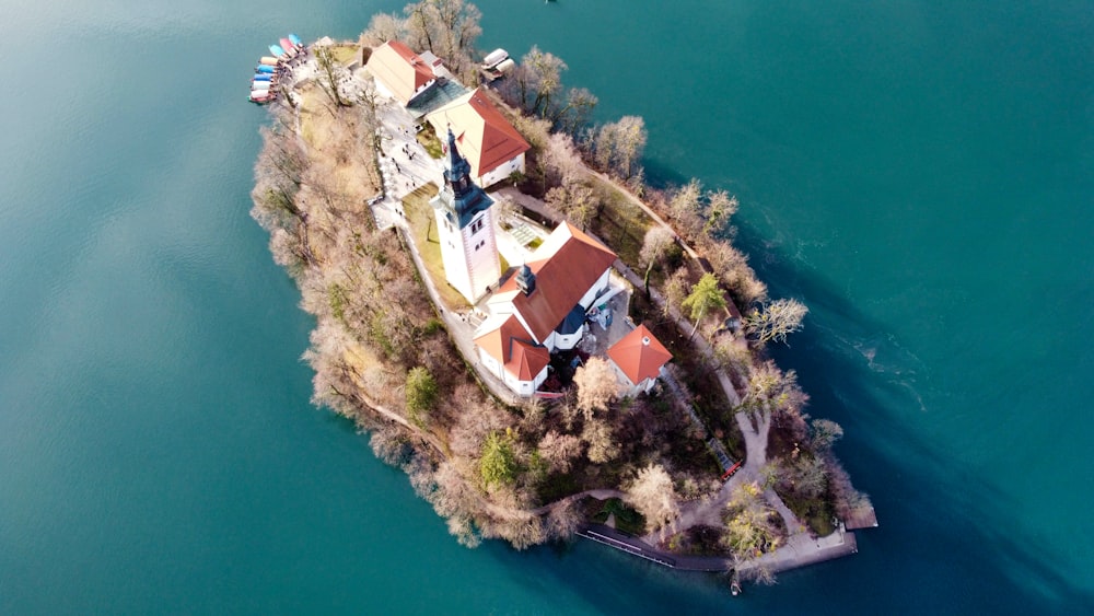 an aerial view of a house on a small island
