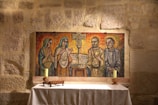 a painting of three people sitting at a table