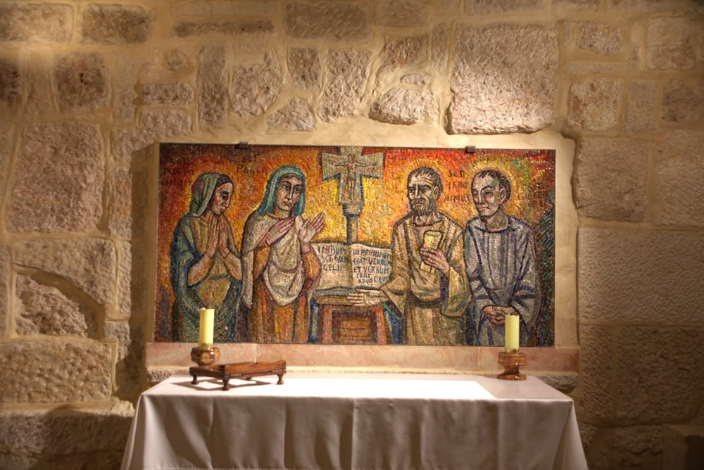 a painting of three people sitting at a table