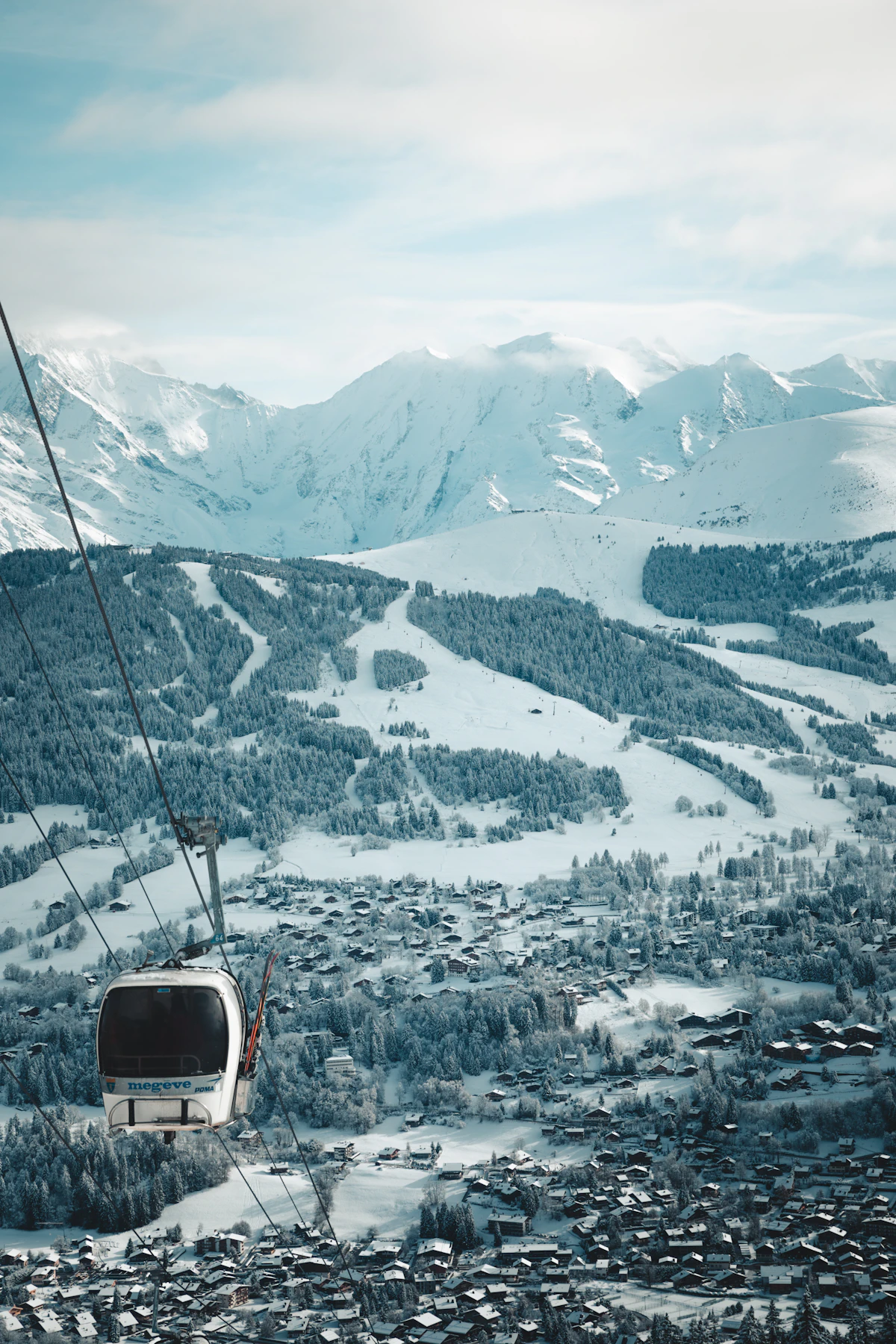 Snow-covered chalets and mountains around Megève, France