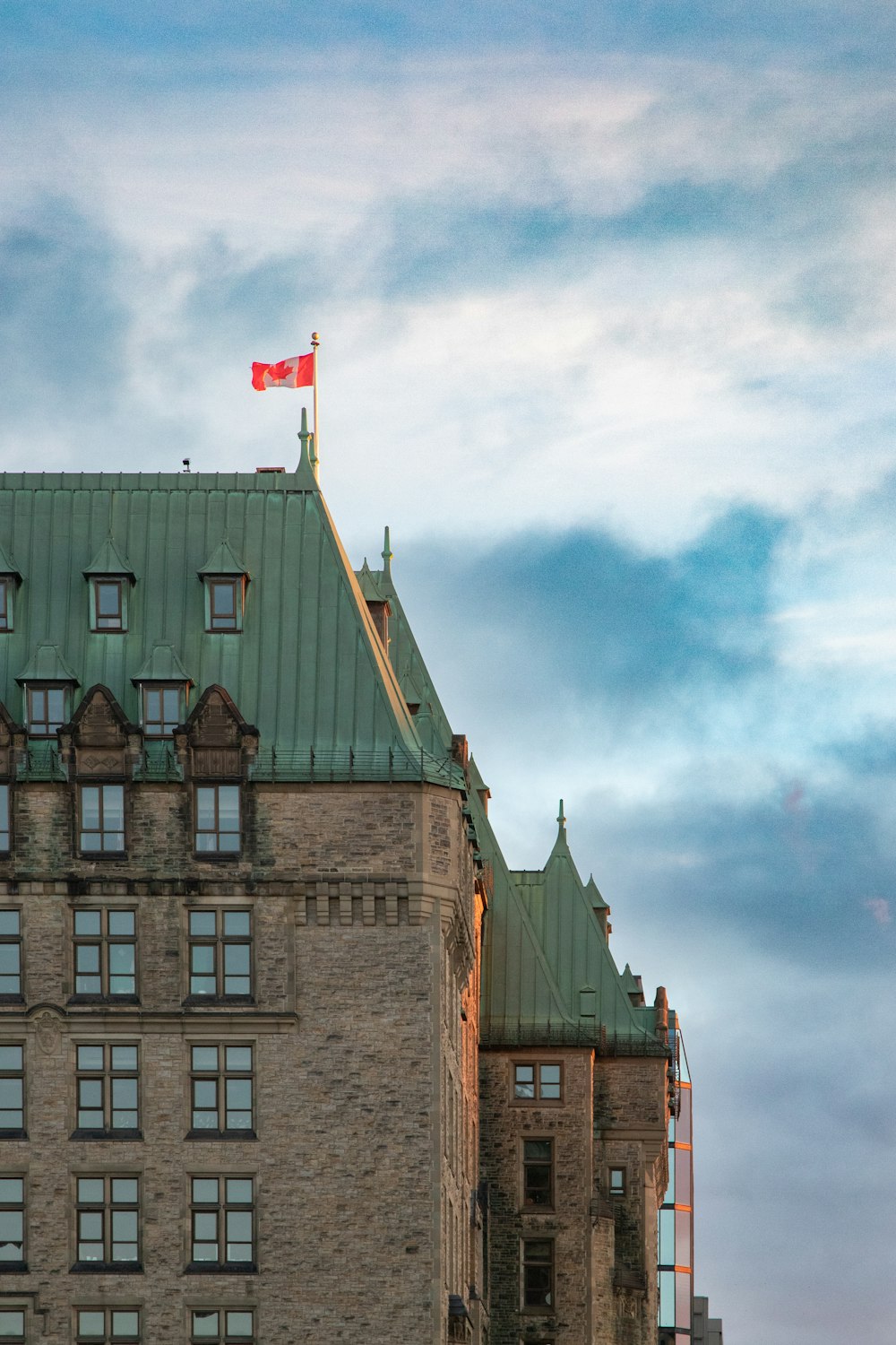 a tall building with a flag on top of it