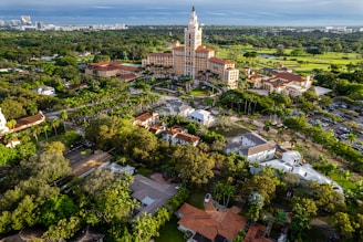 an aerial view of a city with trees and buildings