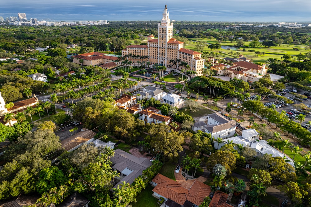 an aerial view of a city with trees and buildings