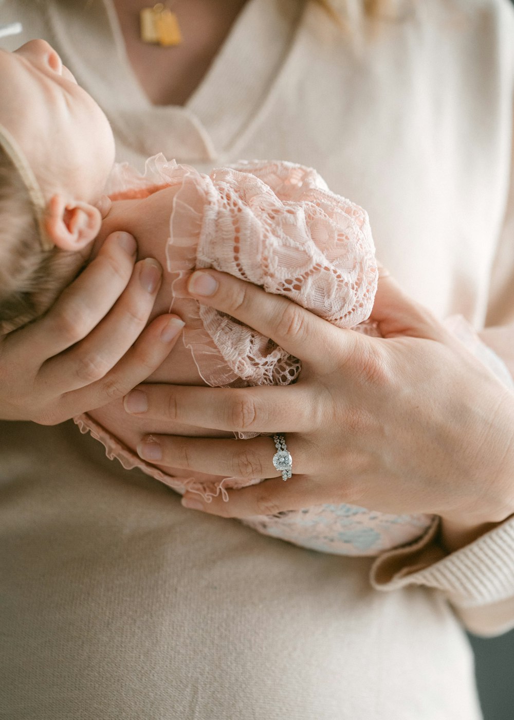 a woman holding a baby in her arms