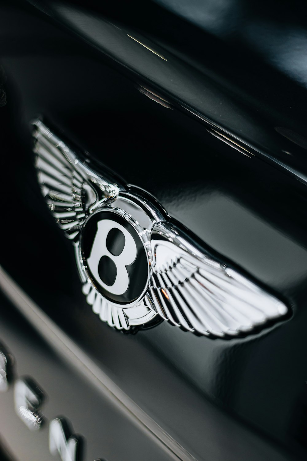a close up of a bentley emblem on a car