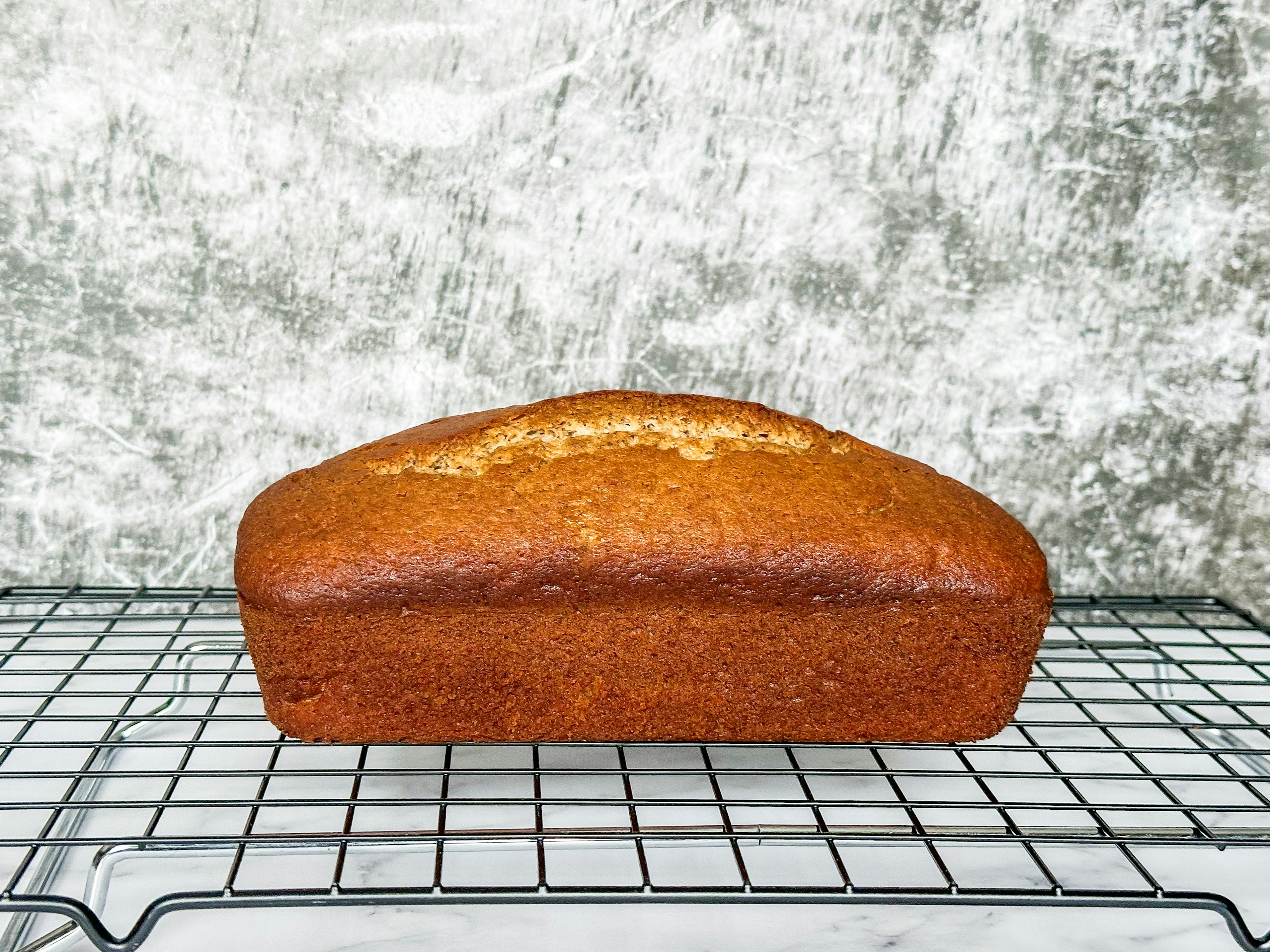 a loaf of bread sitting on top of a cooling rack