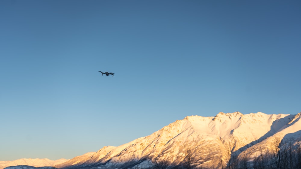 an airplane is flying over a mountain range
