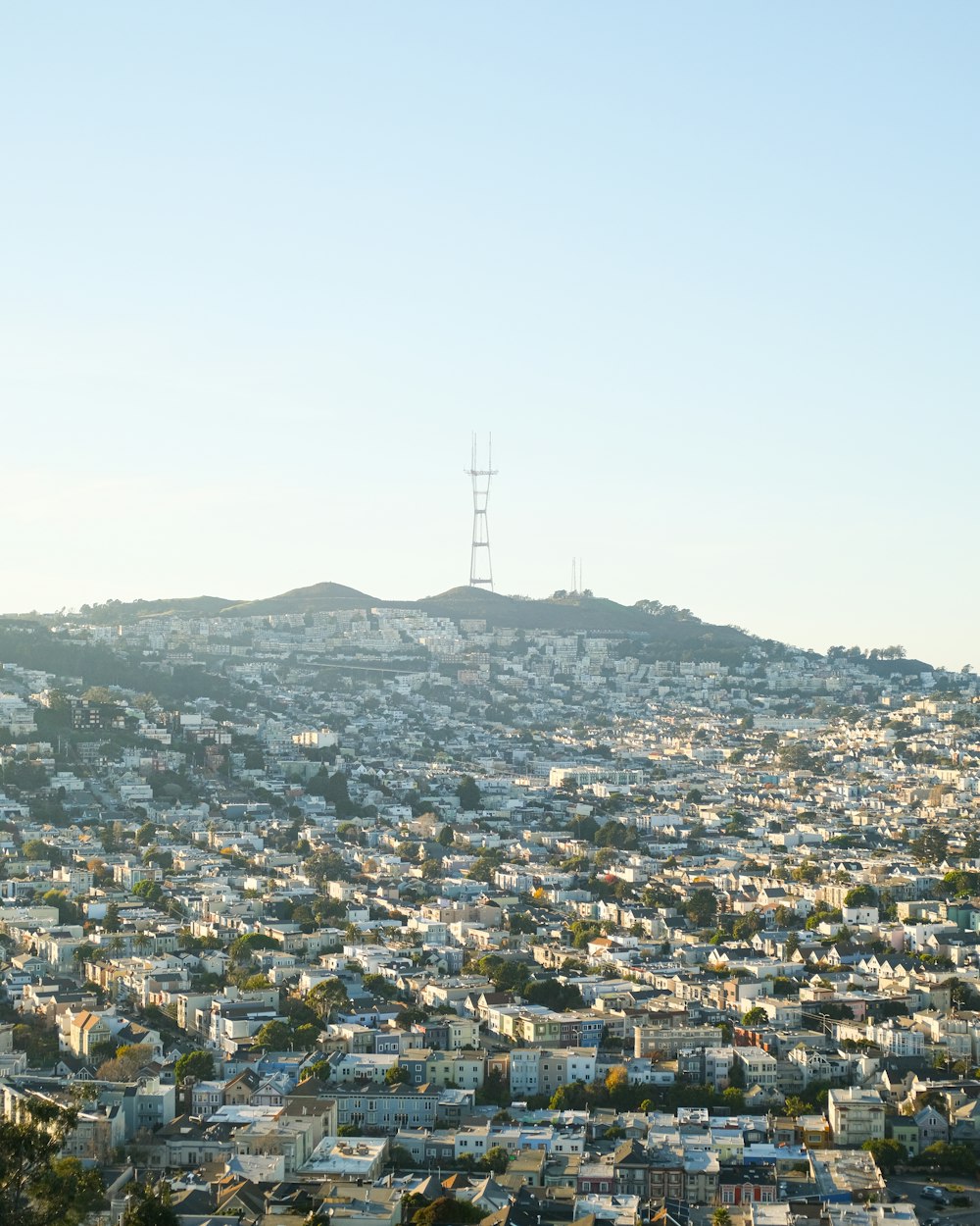 a view of a city from the top of a hill