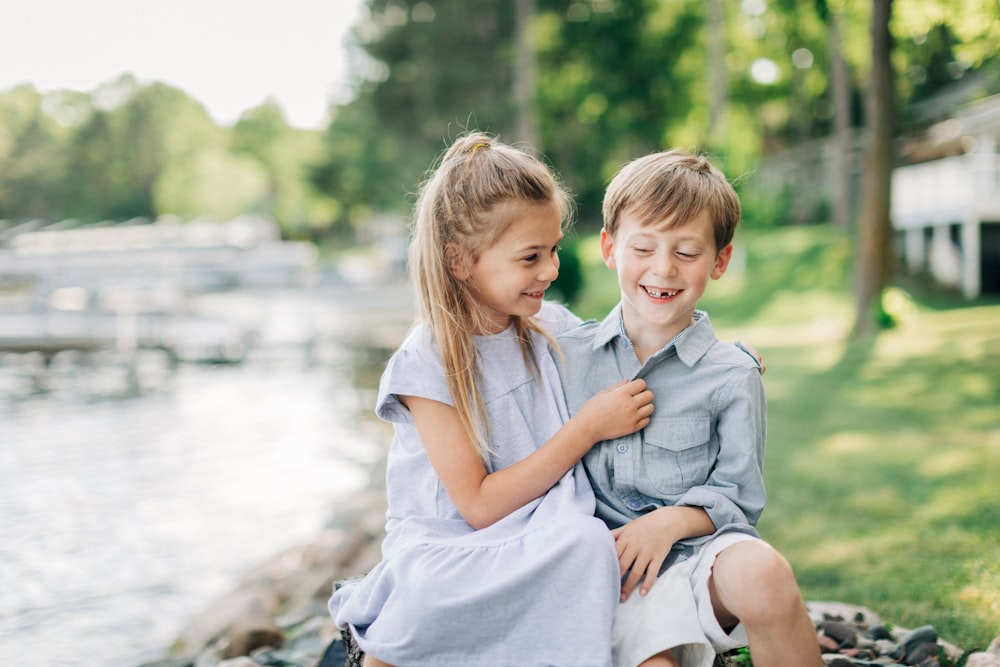 a boy and a girl sitting next to each other