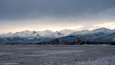 Anchorage along the shore of Knik Arm, under the snow-covered Chugach mountains