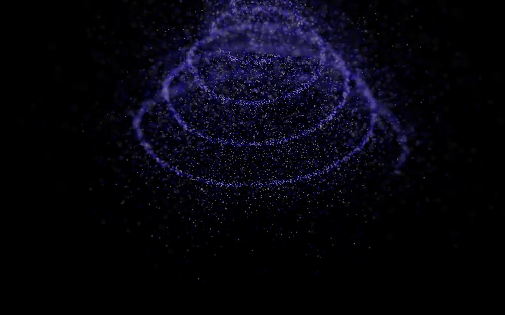 a dark background with a spiral of stars
