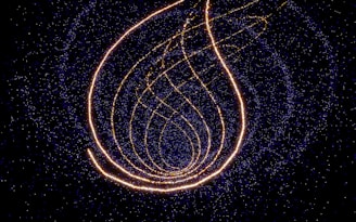 a picture of a string of lights in the dark