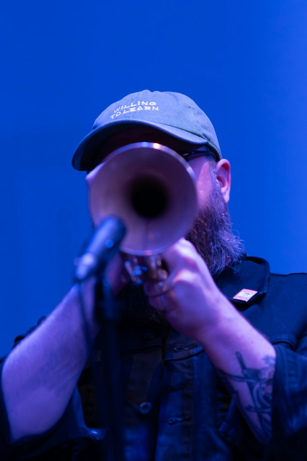 a man with a beard holding a gun