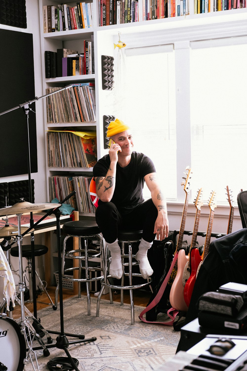 a man sitting on a chair in a room