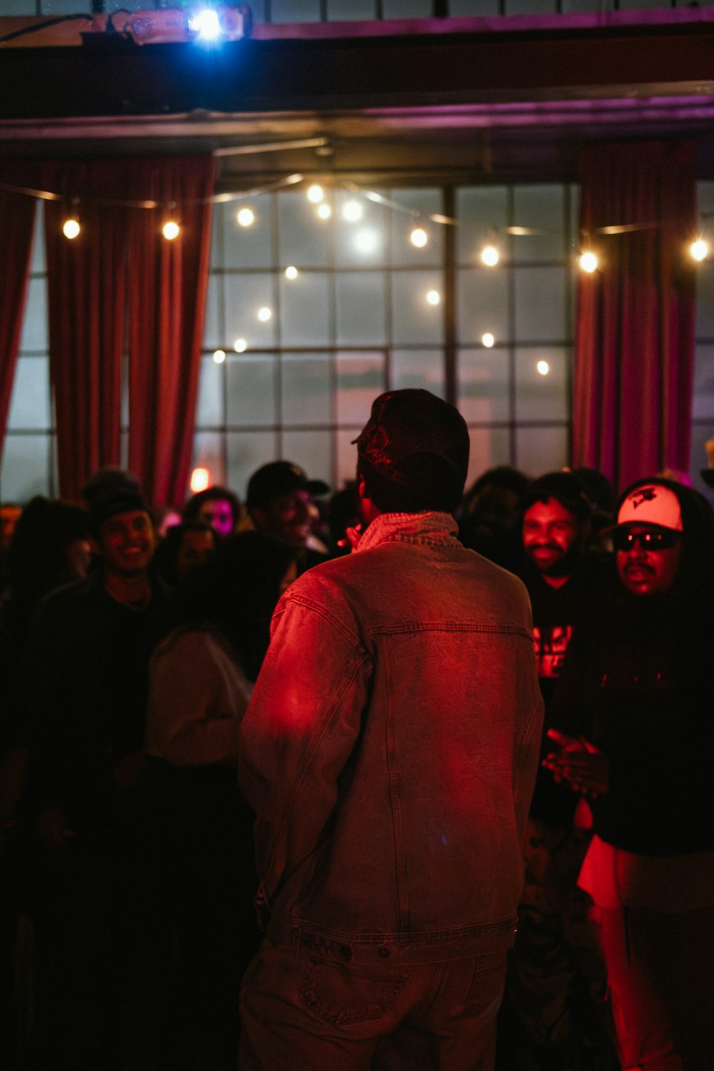 a man standing in front of a crowd of people