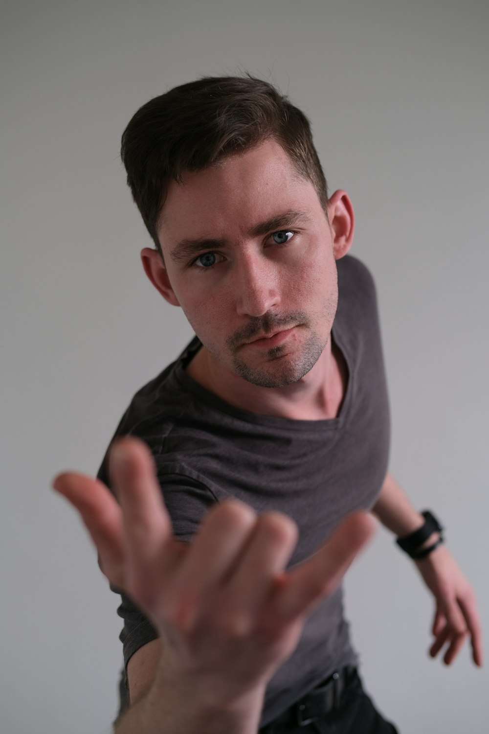 a man making a hand gesture with his fingers