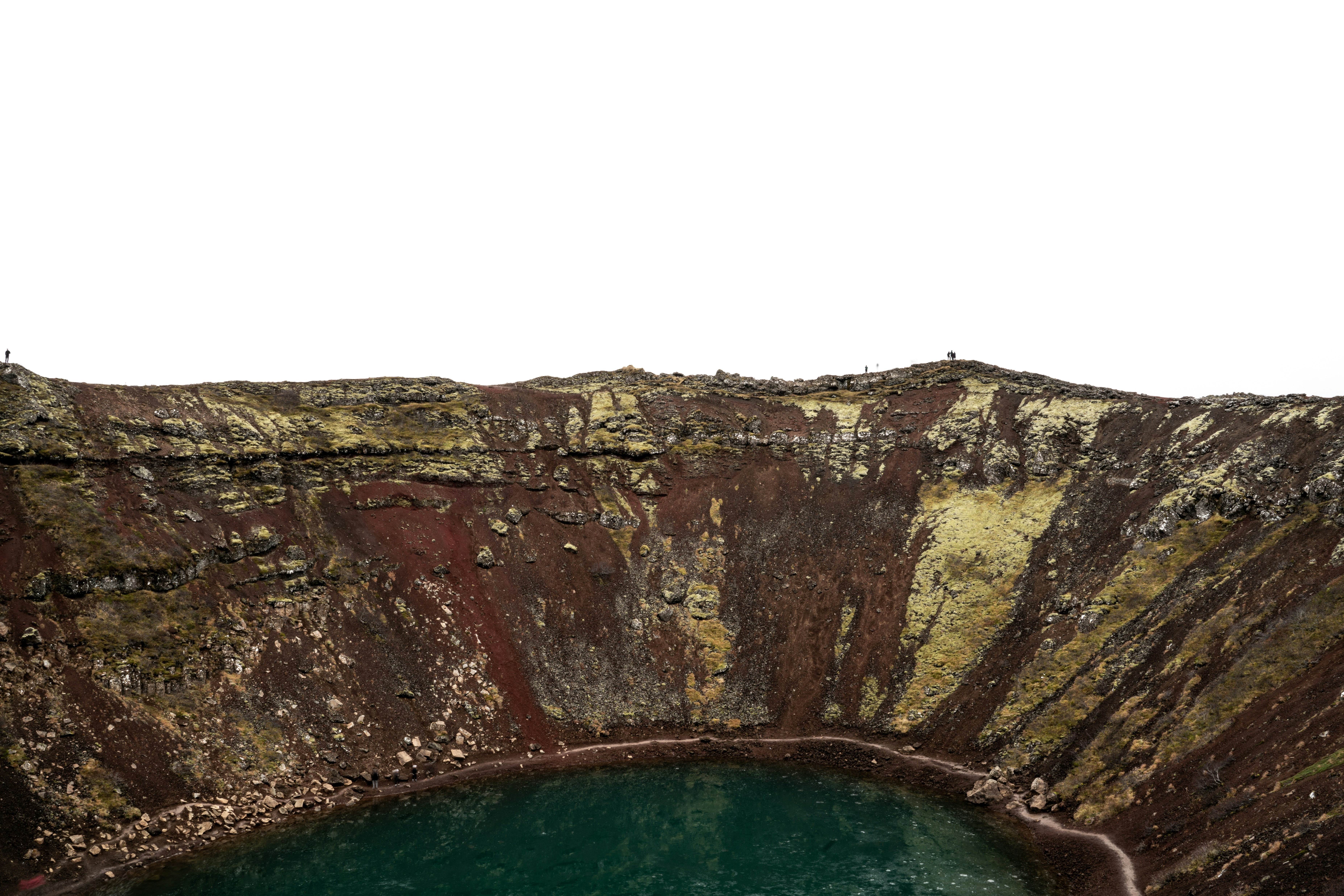a large body of water surrounded by a rocky cliff