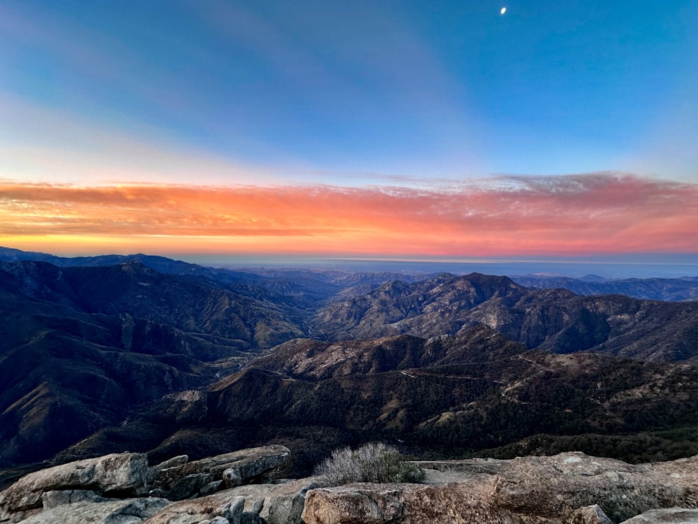 a view of a mountain range at sunset