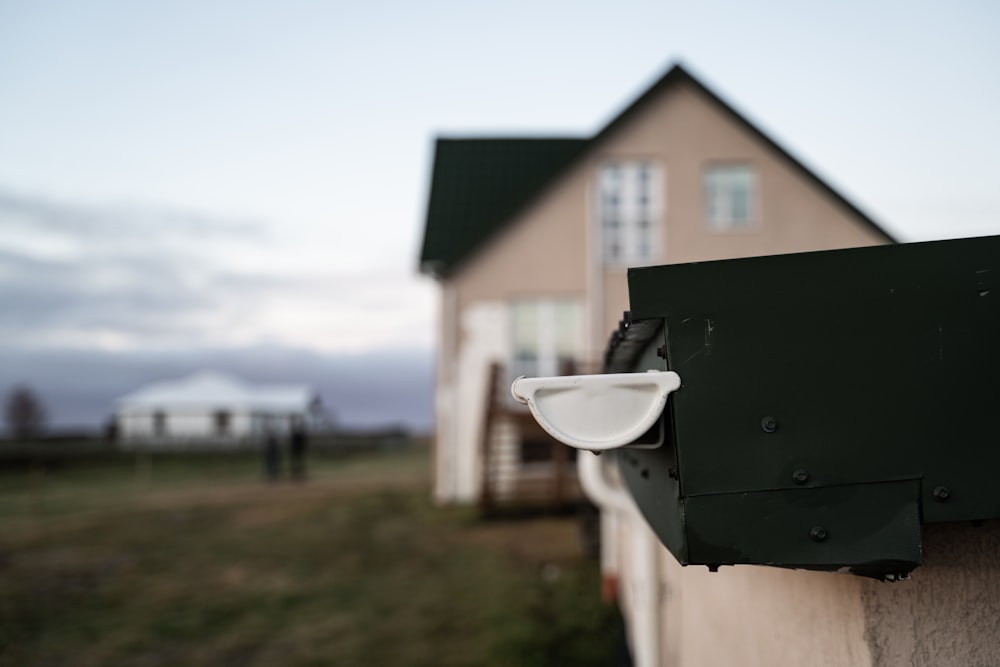 a house with a cup hanging off the side of it