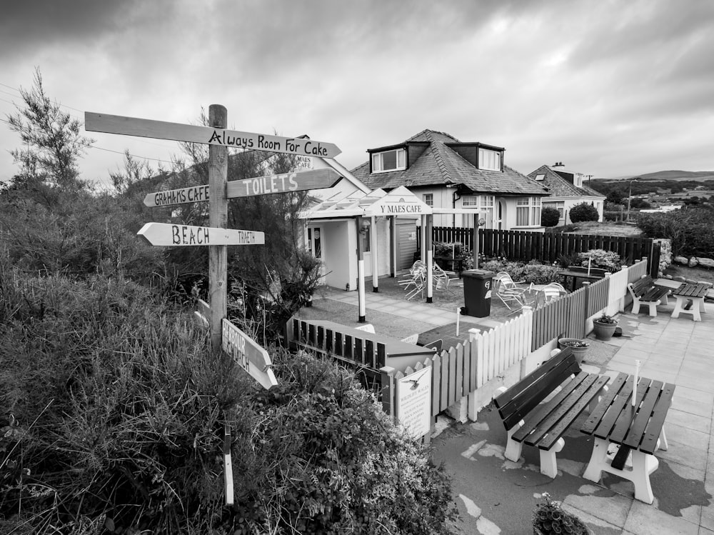 a black and white photo of a street sign