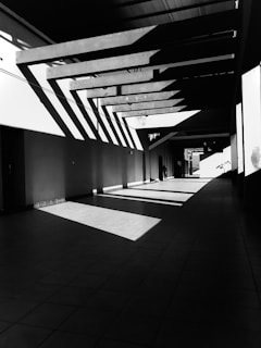 a black and white photo of a hallway