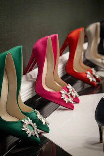 a row of women's high heel shoes on display