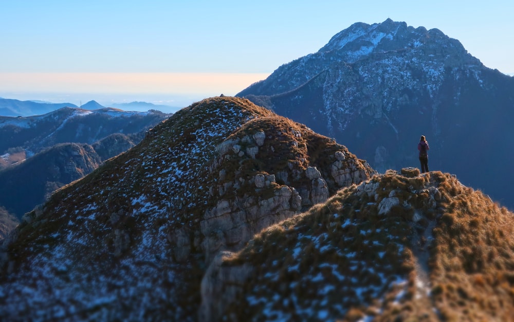 a person standing on top of a mountain