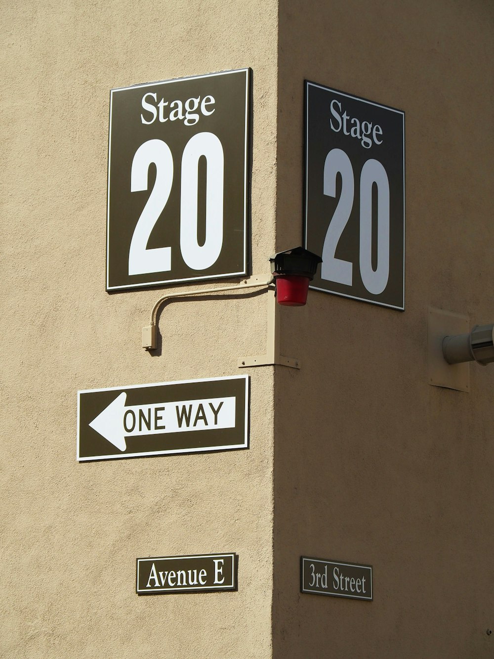 a couple of street signs mounted to the side of a building