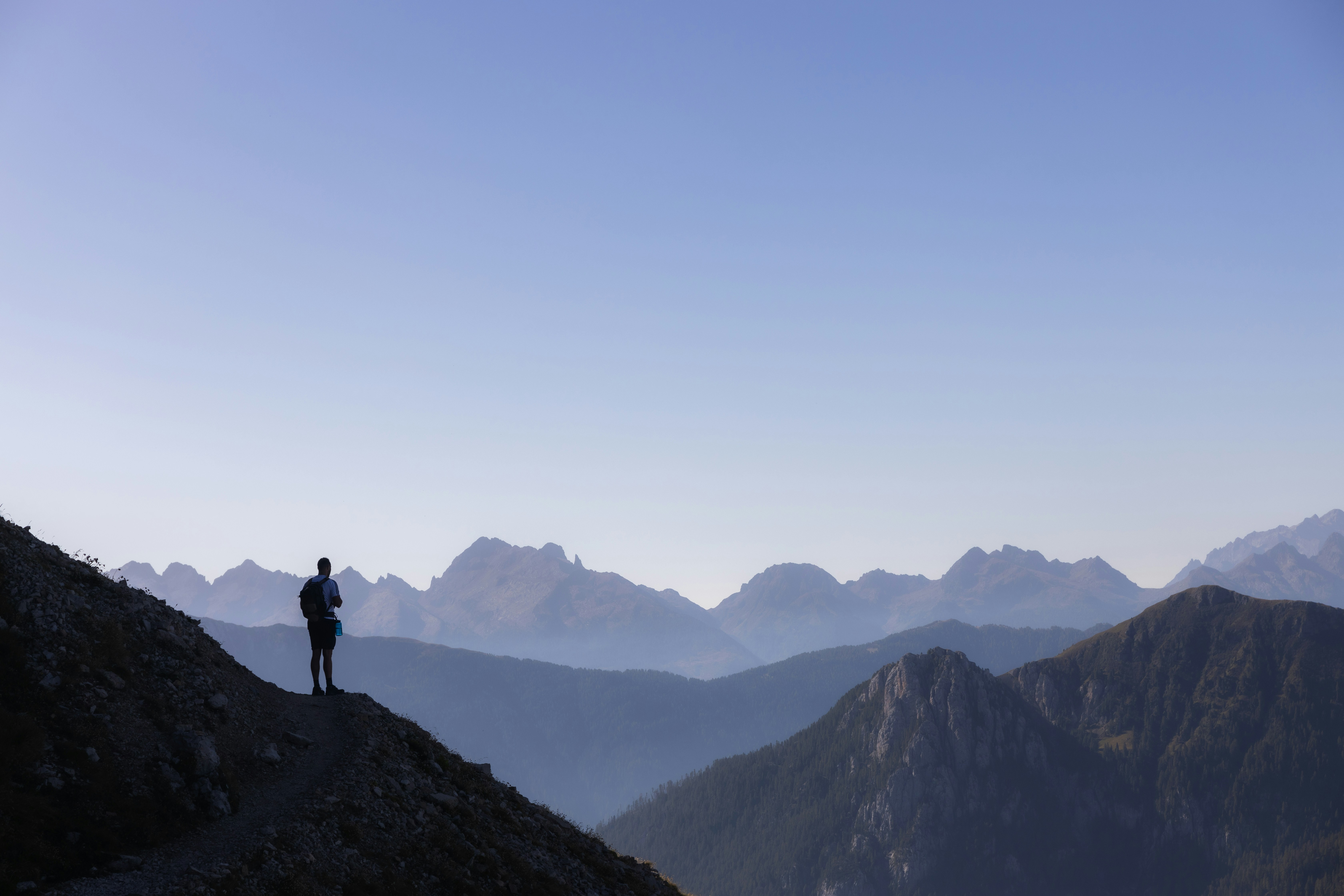 a person standing on top of a mountain