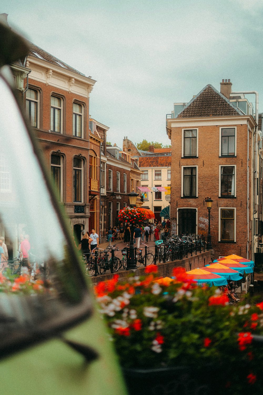 a city street filled with lots of flowers