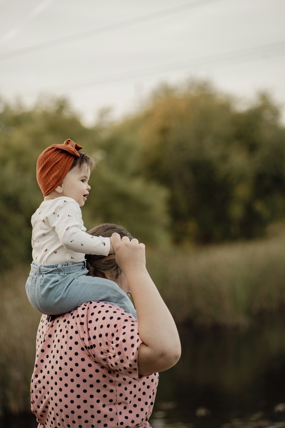 a woman holding a child in her arms